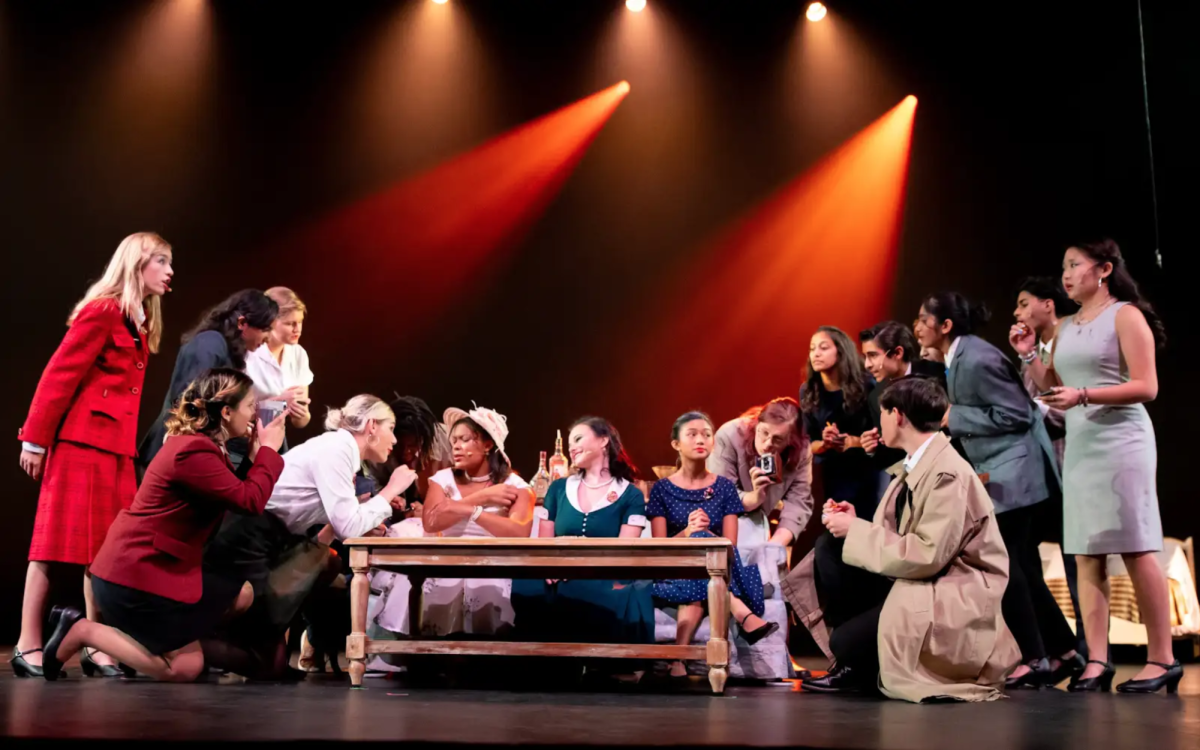 The cast of DHS Drama’s The Best Man are on stage in a scene where the press surround three of the central characters. The performances were held in Dublin High School’s Performing Arts Theater. 